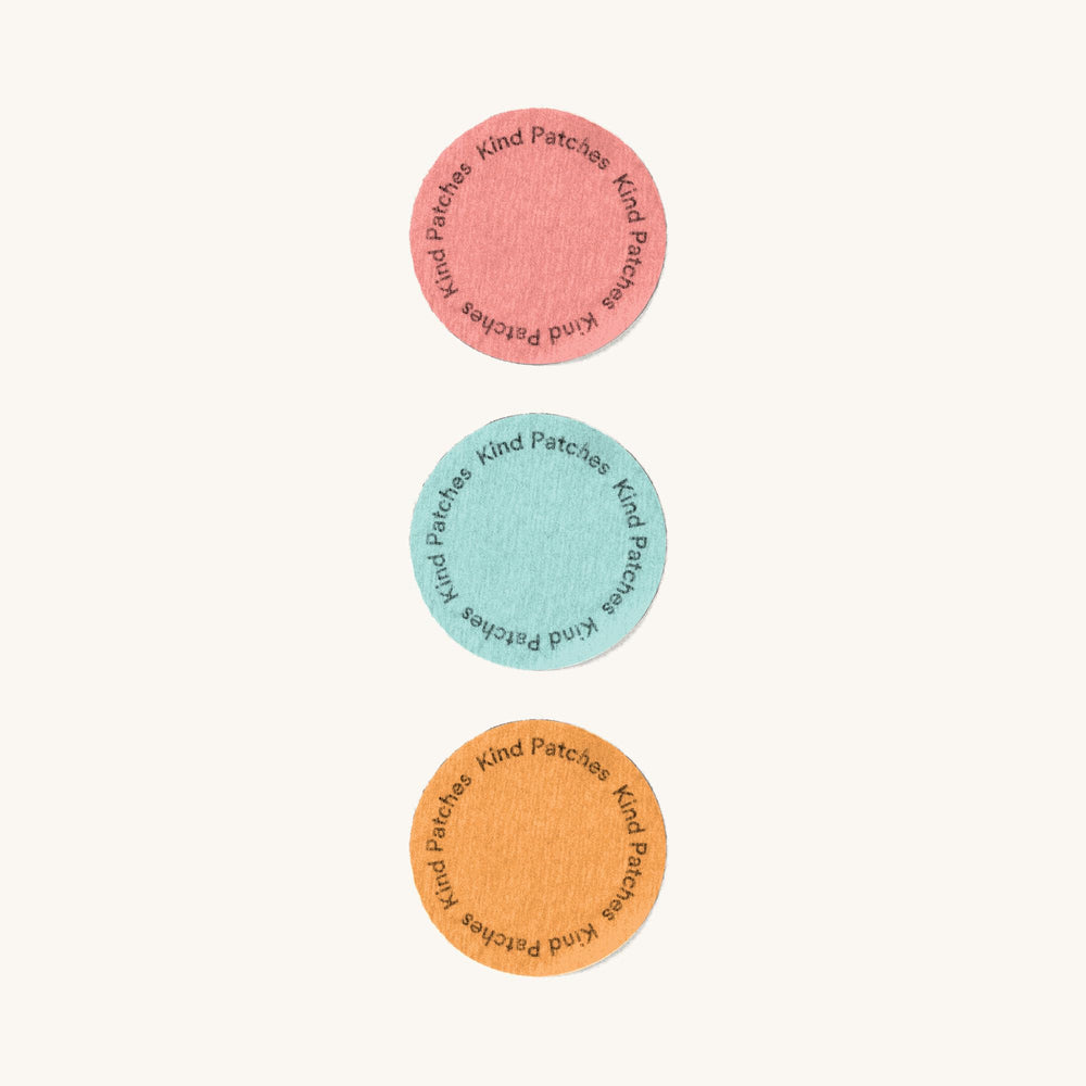 Kind Patches trio on a bathroom vanity with towel, suggests easy integration into routines