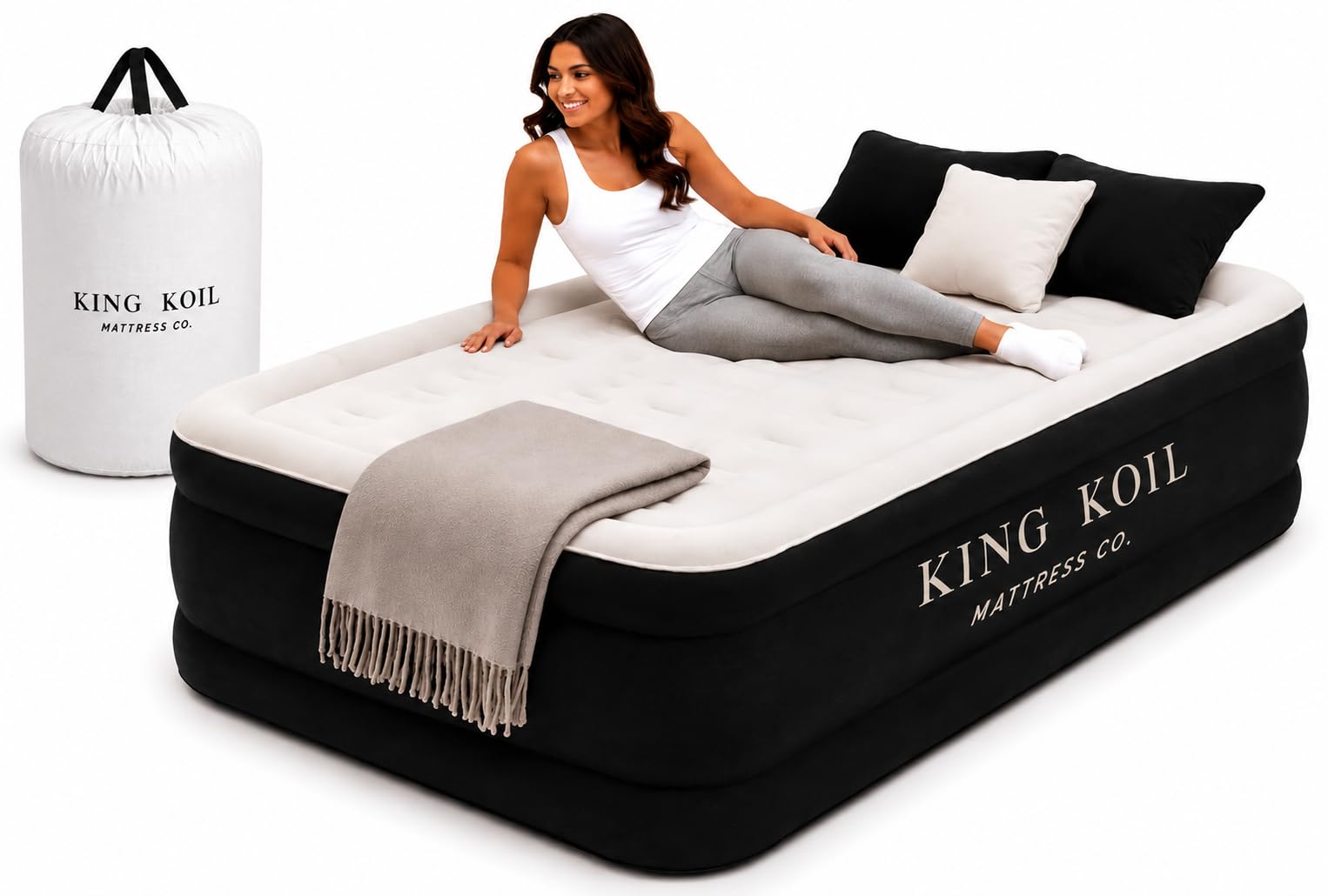 Scale view with foot next to King Koil mattress showing raised profile and height benefit