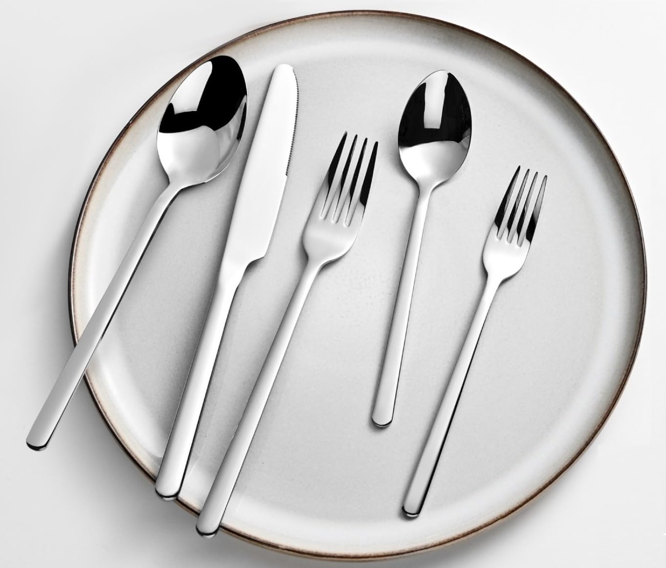KINGSTONE flatware set styled on dining table enhancing meal presentation