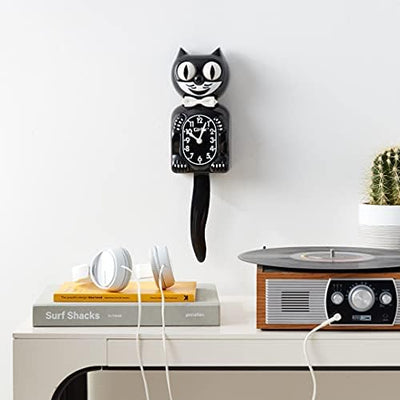 Kit Cat Klock side profile highlighting silhouette, Kit Cat Klock profile fits narrow wall spaces