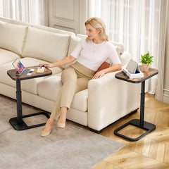 Kitstorack sliding under a sofa to save floor space and provide a handy surface