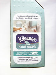Kleenex toalla en uso junto a un lavabo demostrando higiene y comodidad