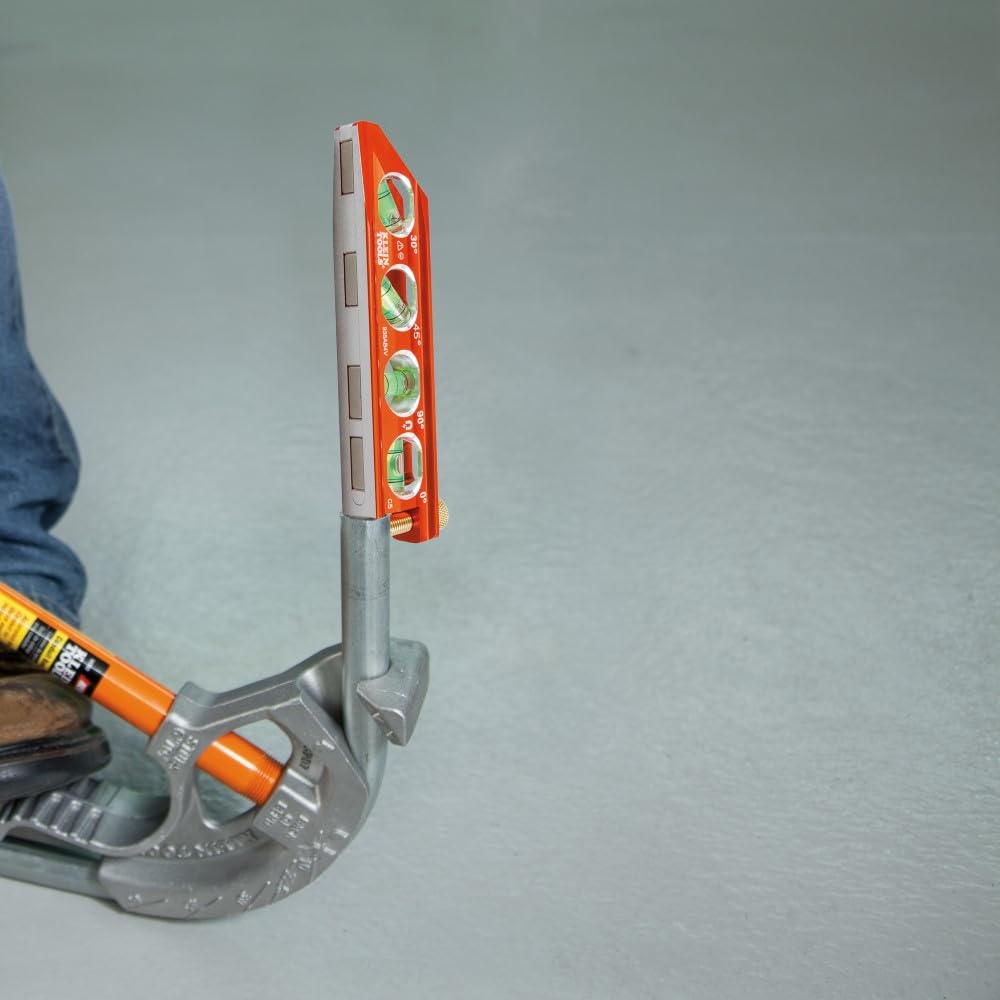 Klein Tools level in use at a jobsite attached to conduit for accurate alignment