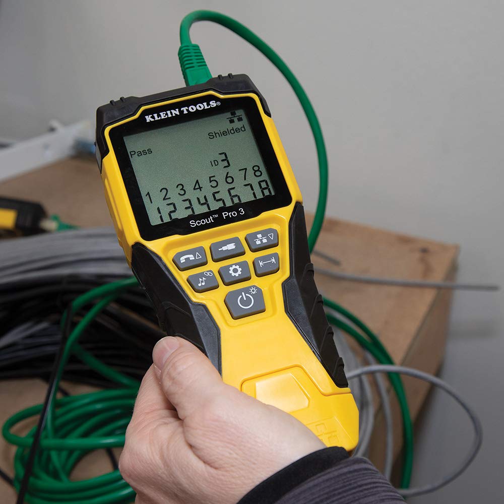 Klein Tools tester held in hand demonstrating portable size and field use