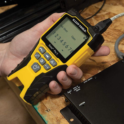 Klein Tools testing an Ethernet cable in a wall cavity for accurate tracing