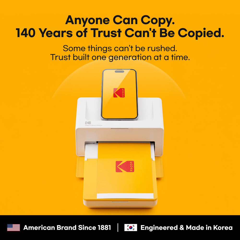 KODAK Dock Plus open paper tray showing 50-sheet capacity benefit for uninterrupted printing