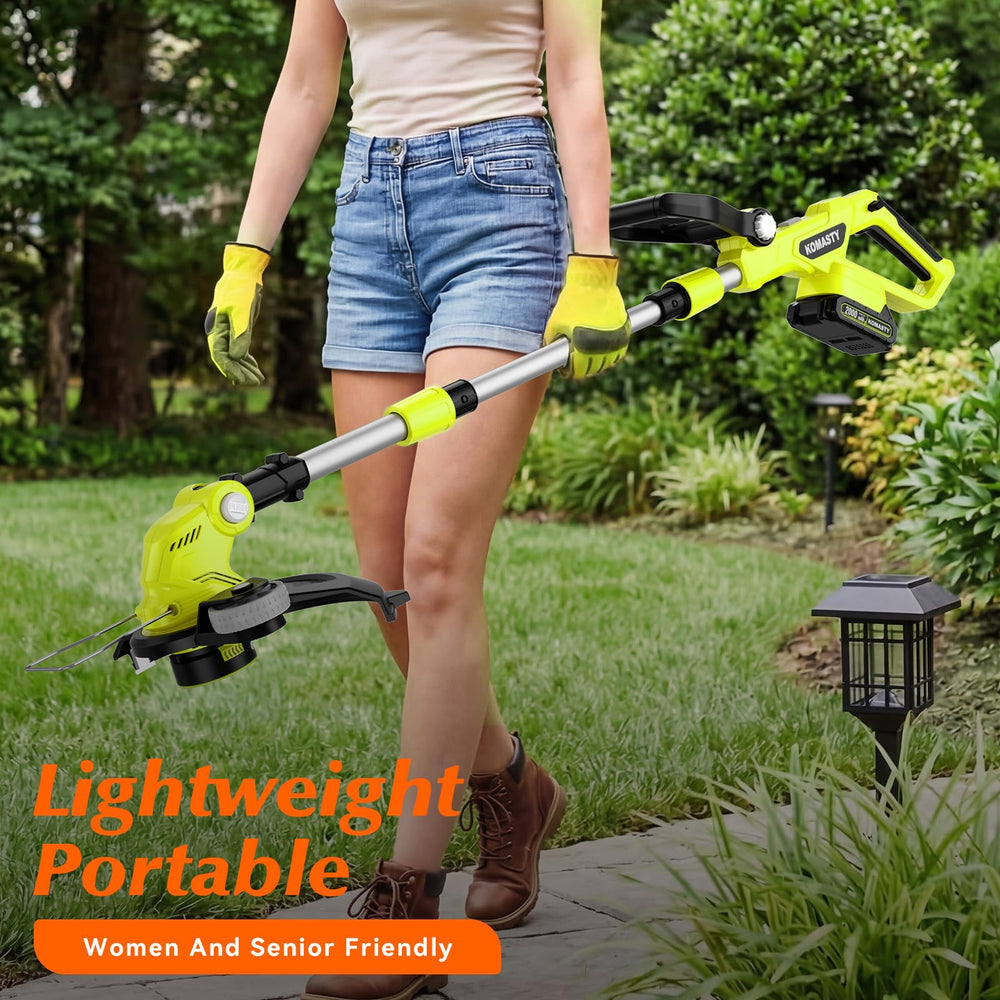 KOMASTY in use edging a sidewalk creating a clean lawn edge