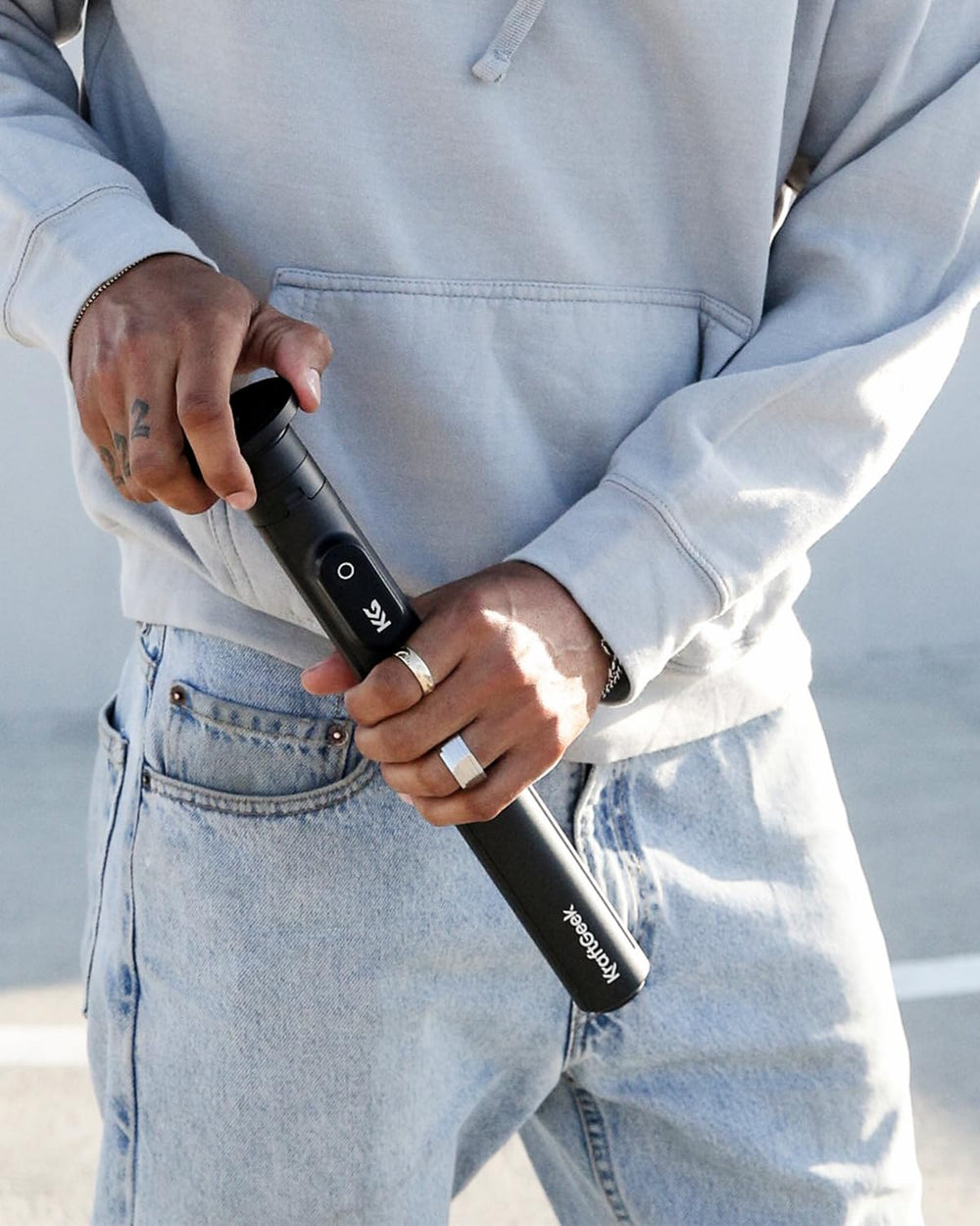 KraftGeek JustTap on sandy beach demonstrating anti-slip feet and stable base