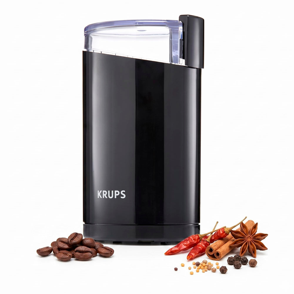 KRUPS vista frontal compacto negro con un solo botón y diseño ahorrador de espacio