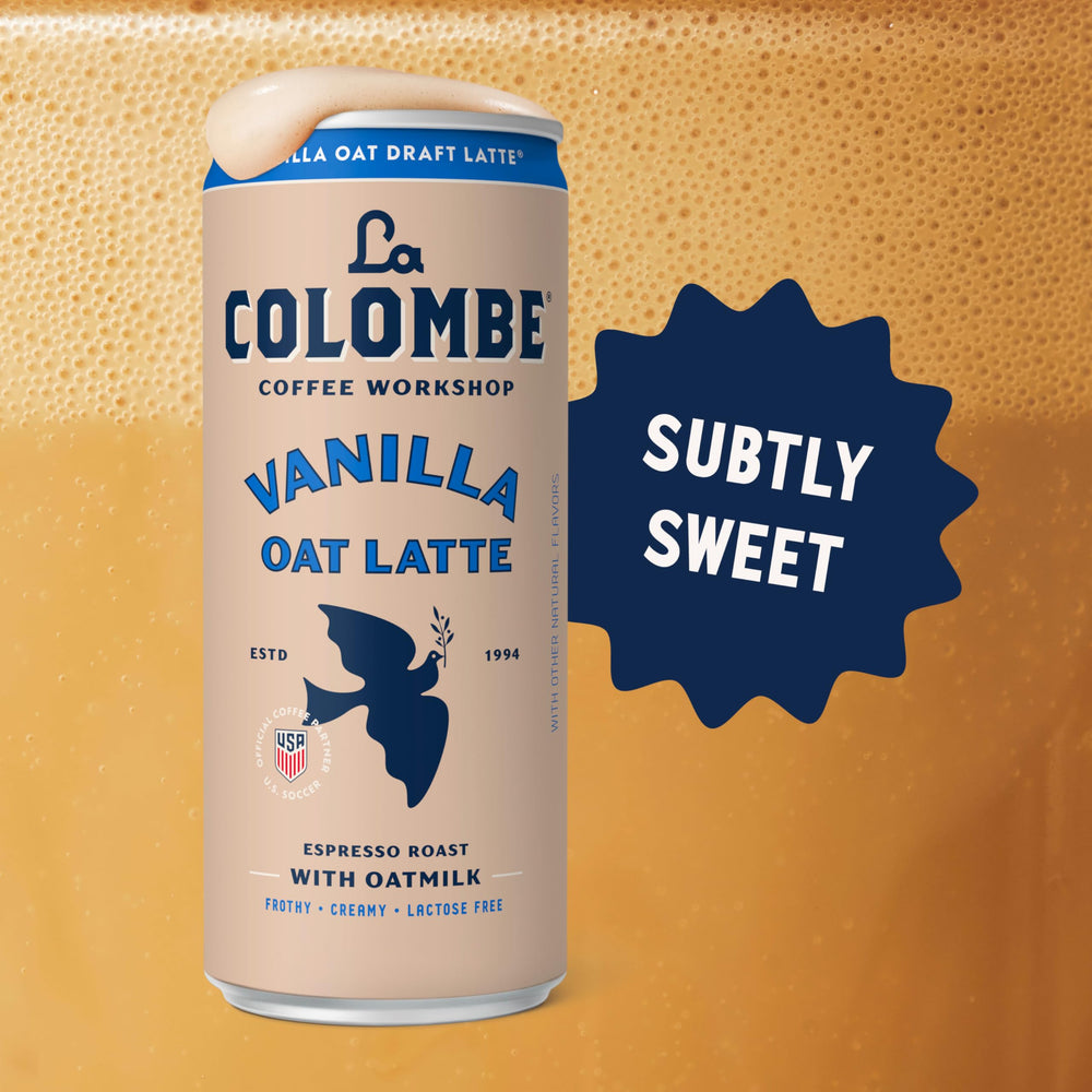 La Colombe lata junto a mano para mostrar tamaño y porción portátil