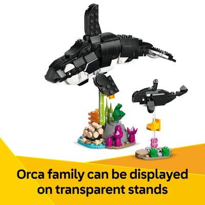Built LEGO penguin and chick on ice base demonstrating poseable flippers, LEGO imaginative play