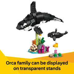 Built LEGO penguin and chick on ice base demonstrating poseable flippers, LEGO imaginative play