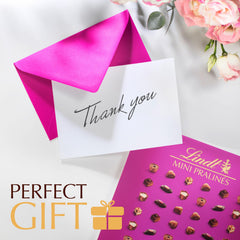 Lindt caja abierta con surtido visible y presentación lista para regalar