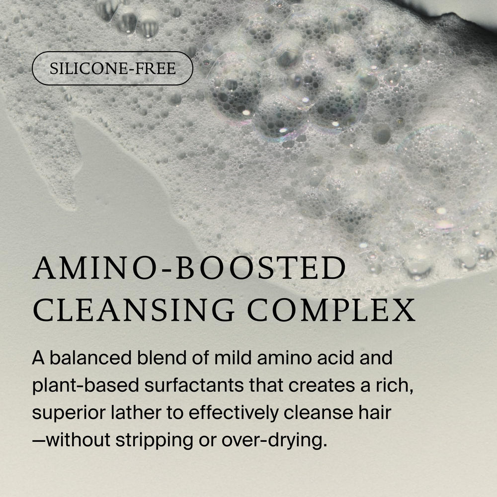 Living Proof botella abierta con gotas que sugieren fácil dispensado
