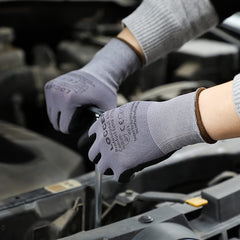 LOCCEF gloves in use gripping hand tools to demonstrate dexterity and secure hold