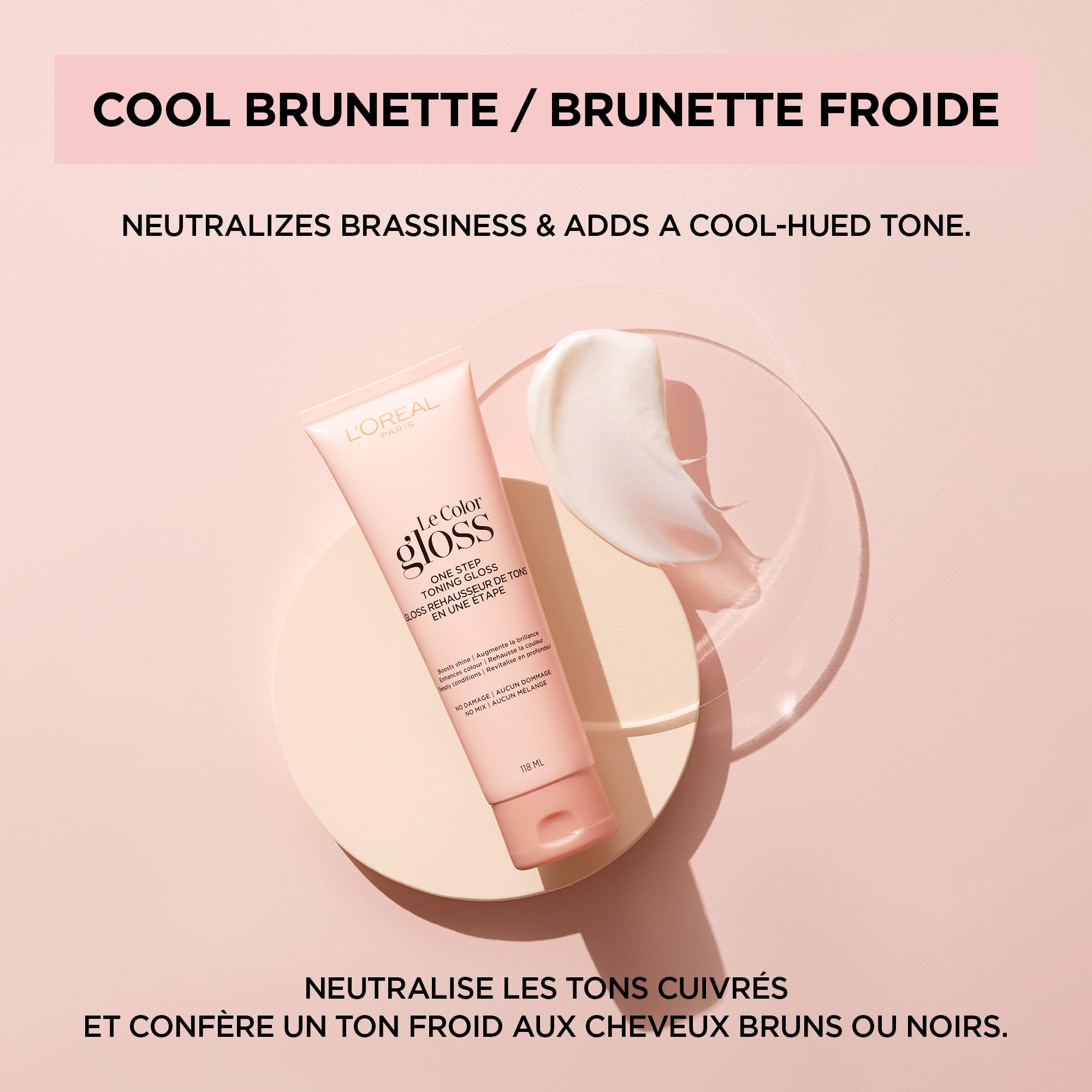 L'Oreal Paris tubo 4 oz junto a mano para comparar tamaño portátil