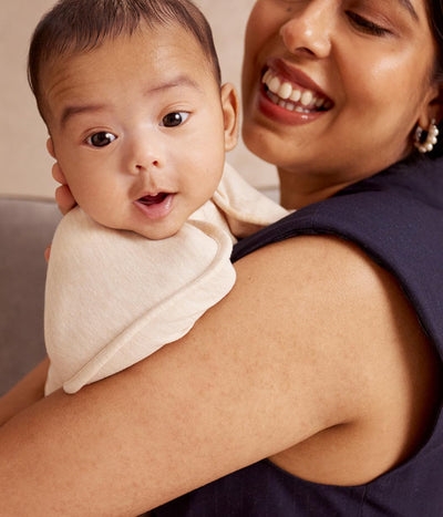 Love to Dream baby wearing swaddle in arms-up position promoting self-soothing