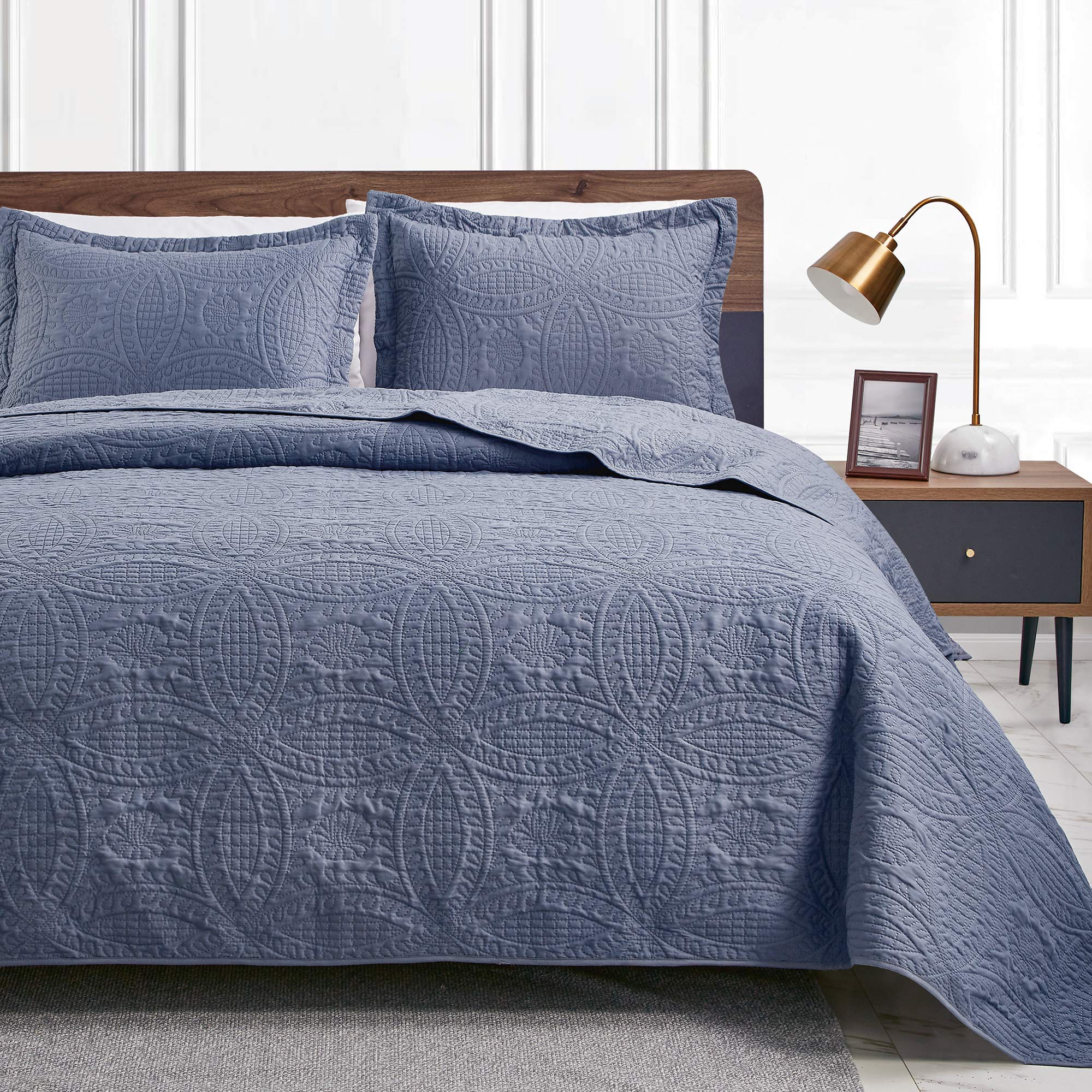 Love's cabin front view quilt showing full queen coverage and modern blue look