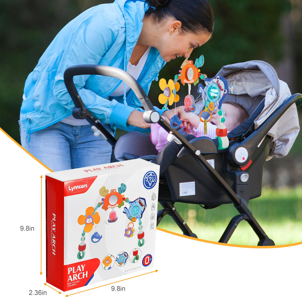 Lynncare baby reaching and smiling at arch illustrating engagement and development