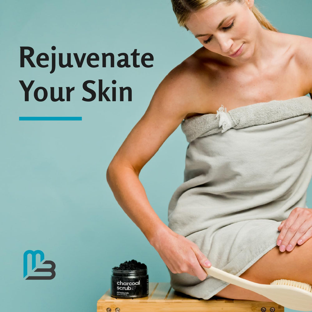 M3 Naturals applying scrub to elbow and knee for smoothing benefit