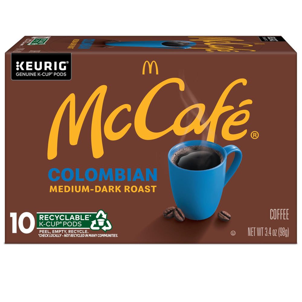 McCafé cápsula junto a moneda para comparación de tamaño y porción individual