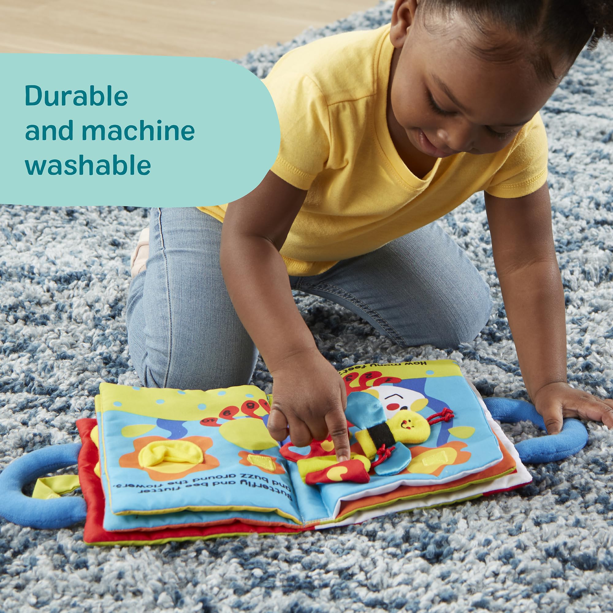 Melissa & Doug página con botón y hebilla para práctica de motricidad fina