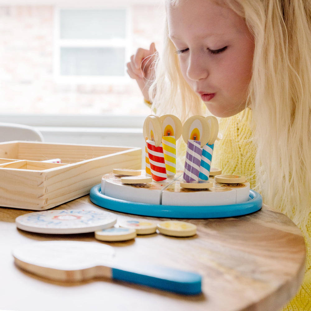 Melissa & Doug cake next to child hand showing scale and child-friendly sizing benefit