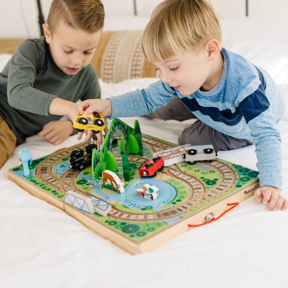 Melissa & Doug open railway playset displaying tracks and scenery benefits