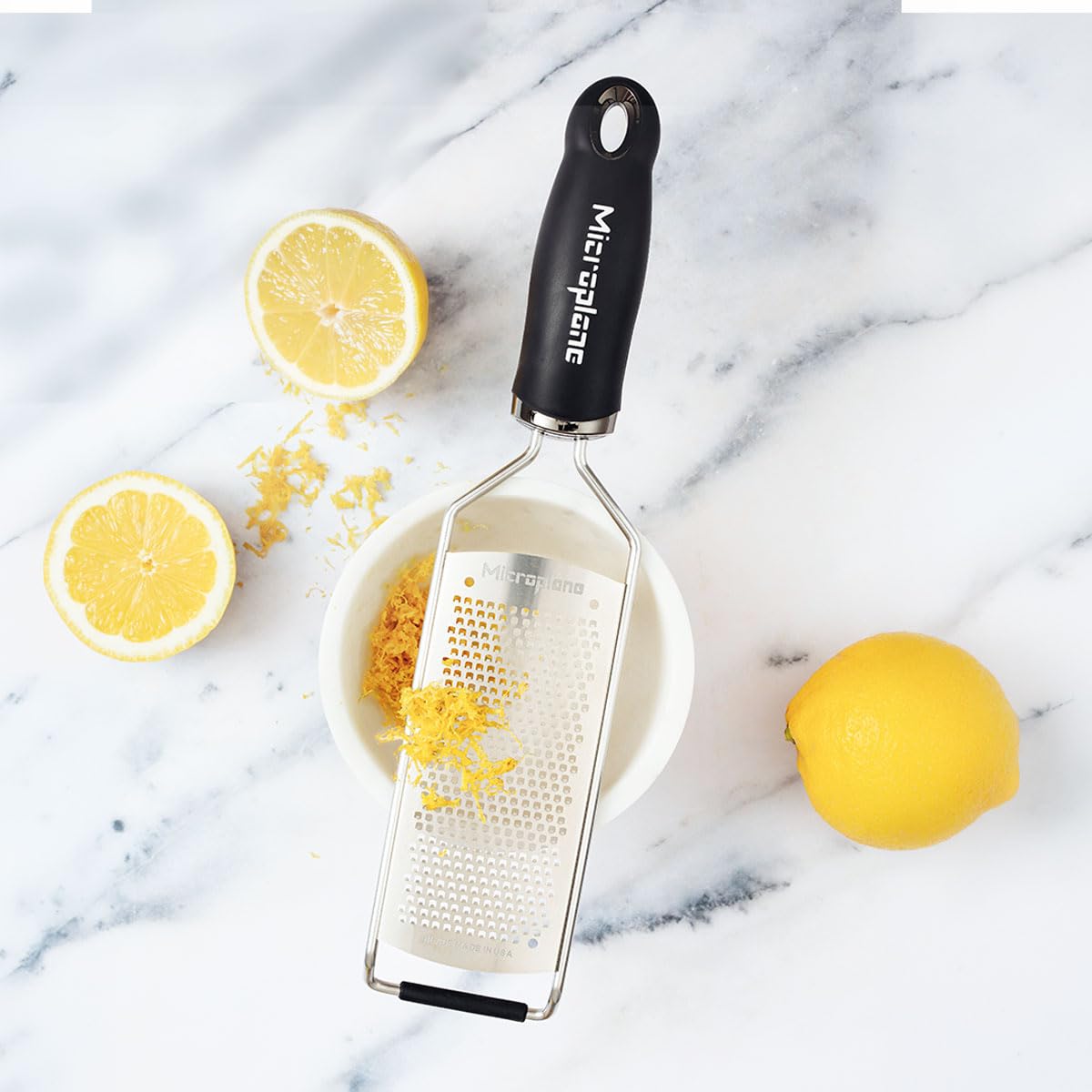 Microplane fine grater close-up of razor teeth highlighting sharpness for powdery cheese