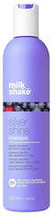 milk_shake envase frontal mostrando el champú y su beneficio antiamarilleo