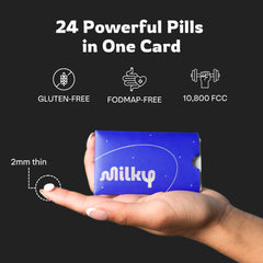 Milky tablet beside fork for scale demonstrating pocketable size