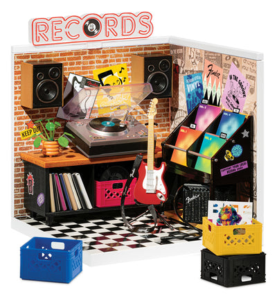 MGA's Miniverse guitar case and picks arranged to showcase accessory detail
