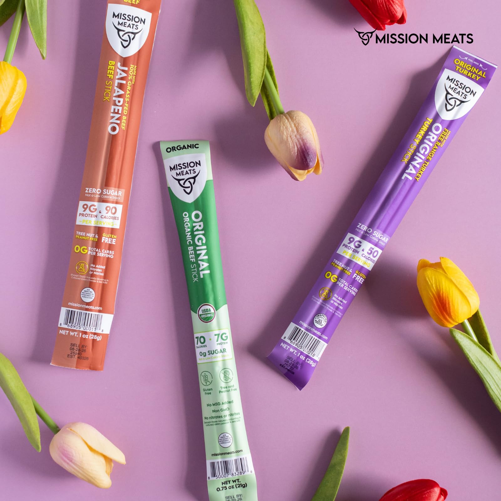 Mission Meats stick held in hand showing 1oz size for portion control and convenience