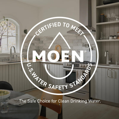 Moen 1222 beside a coin for scale showing compact OEM replacement size