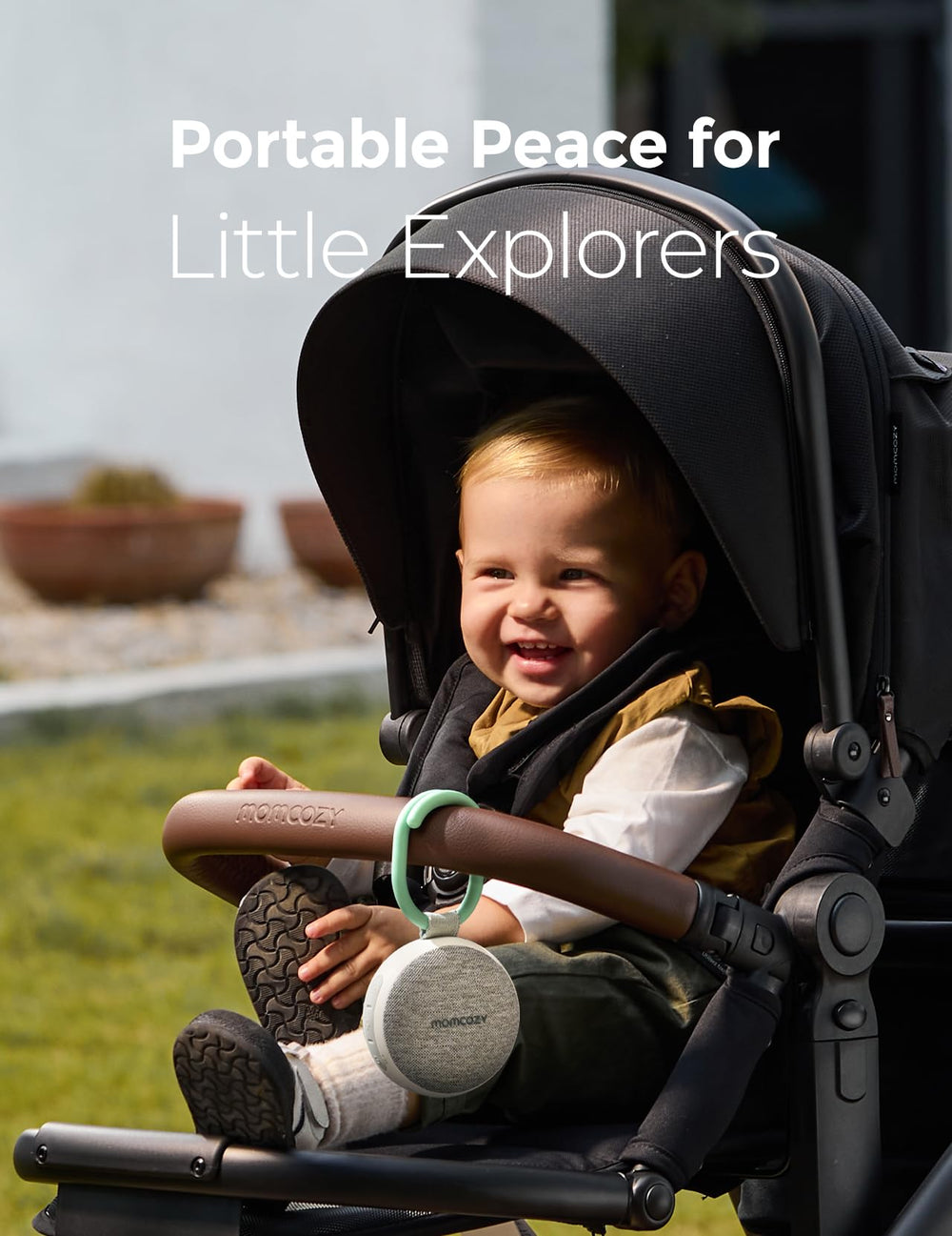 Momcozy clipped to stroller demonstrating secure attachment and soothing naps outdoors