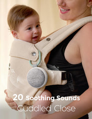 Momcozy next to diaper for scale showing small size and easy packing