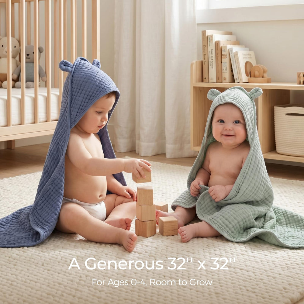 Momcozy toalla desplegada mostrando las seis capas estructurales