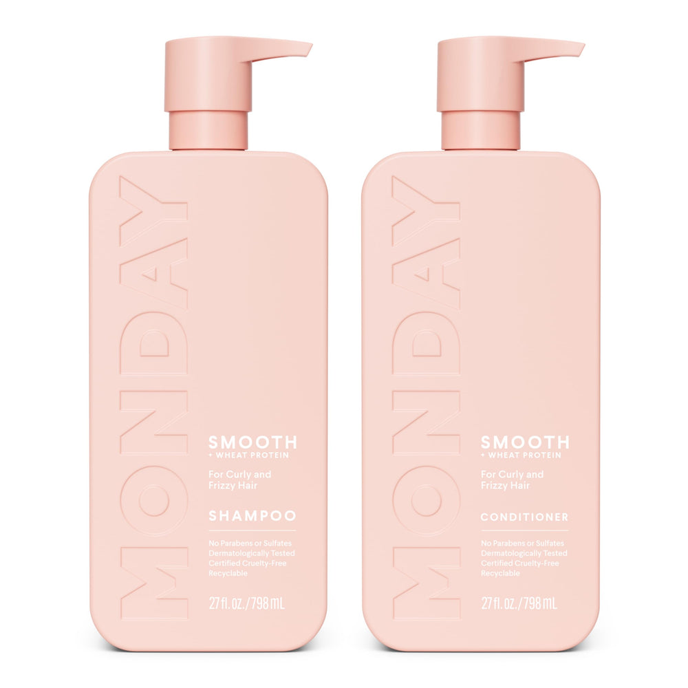 MONDAY HAIRCARE set frontal mostrando botellas rosas y beneficio suavidad