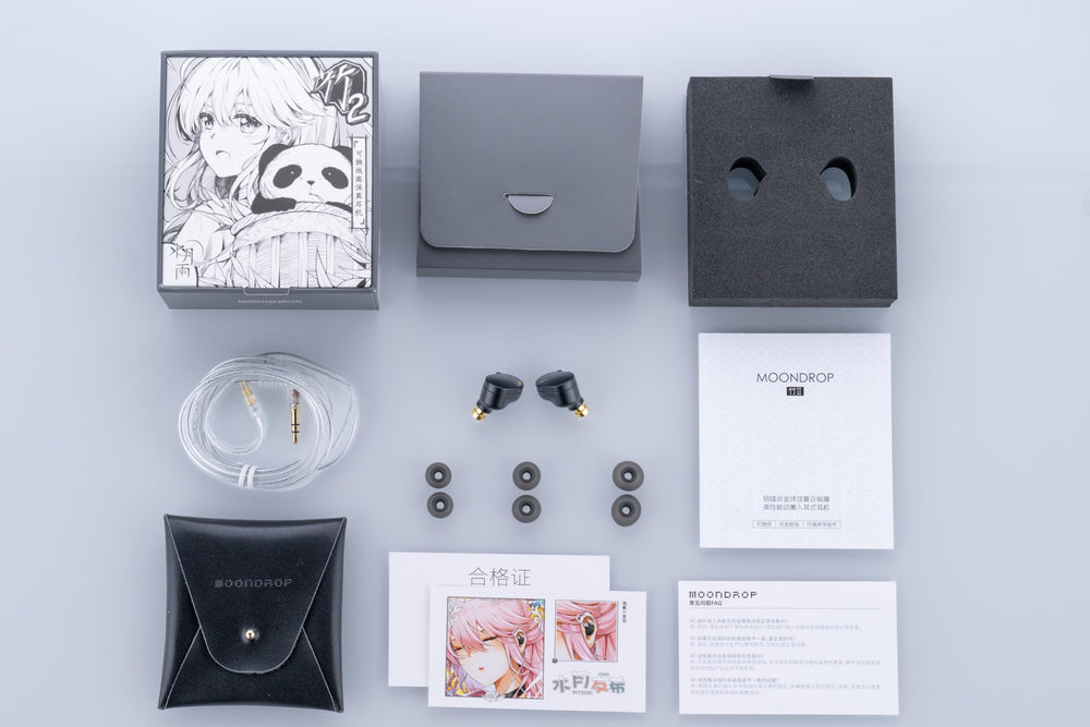 Moondrop CHU II comparación de tamaño junto a moneda para escala real