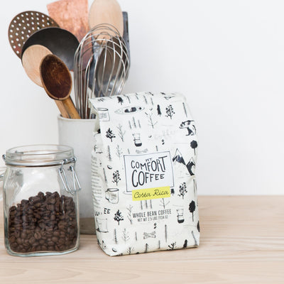 Mt. Comfort Coffee bag beside a scale illustrating the 2.5 lb size advantage