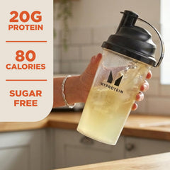 Myprotein tub beside measuring scoop showing 20 servings scale