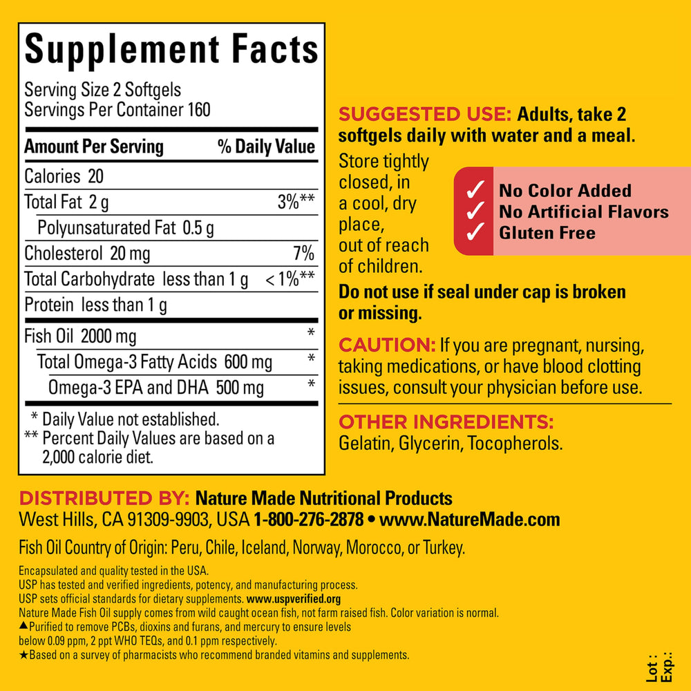 Hand holding a Nature Made fish oil softgel demonstrating small size and daily use convenience