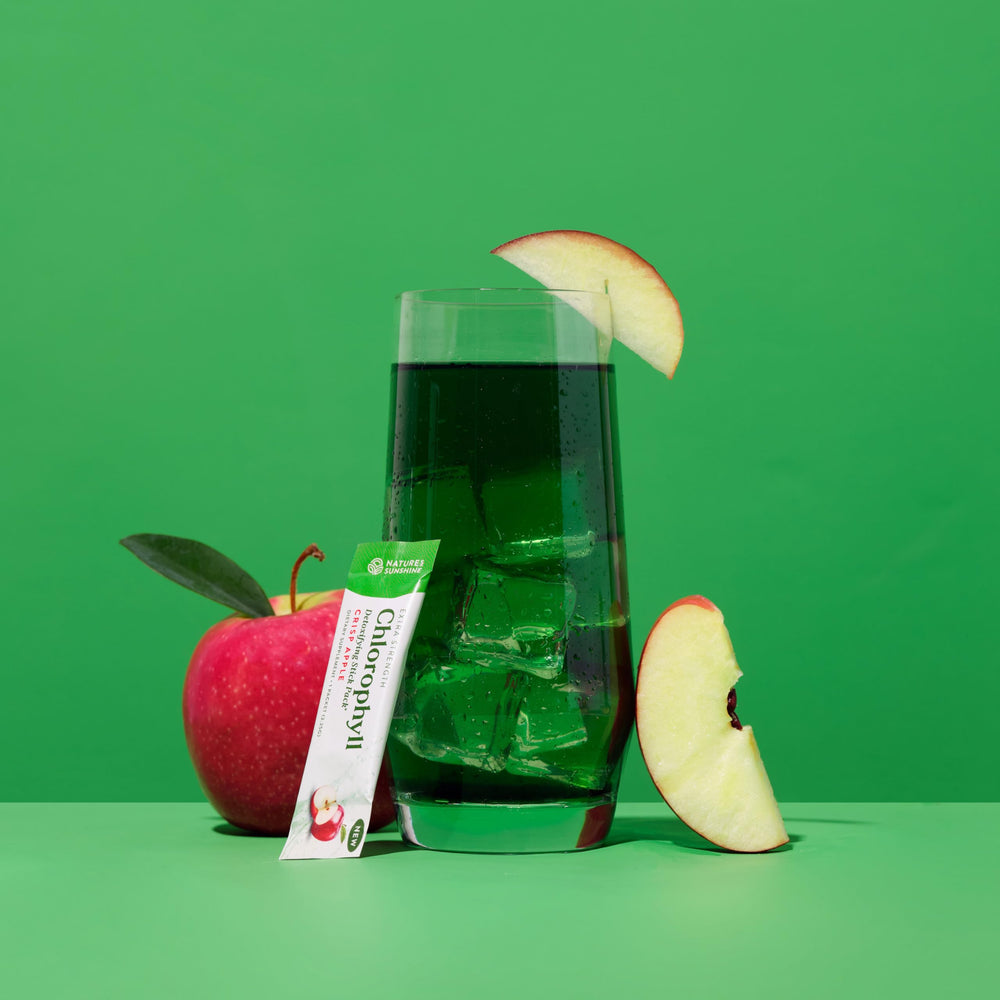 Nature's Sunshine mixed drink in glass offering refreshing apple-flavored support