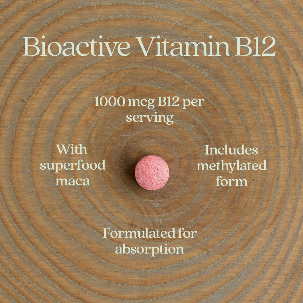 Hand holding New Chapter B12 tablet showing scale and easy-to-swallow size benefit