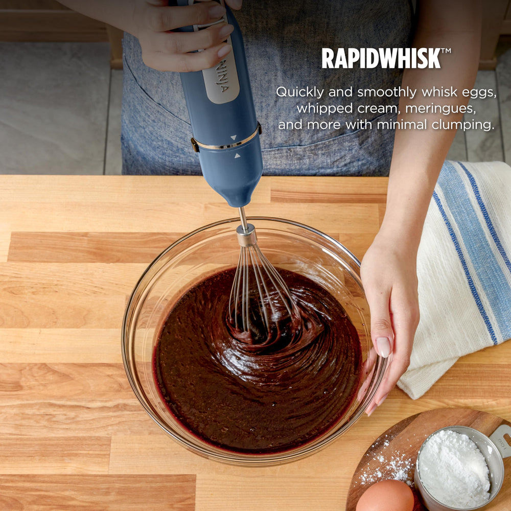Ninja blender in pot scene blending hot soup with SplatterShield to reduce countertop mess