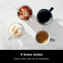 Ninja CM371 pouring from 12-cup glass carafe delivering consistent hot coffee flavor