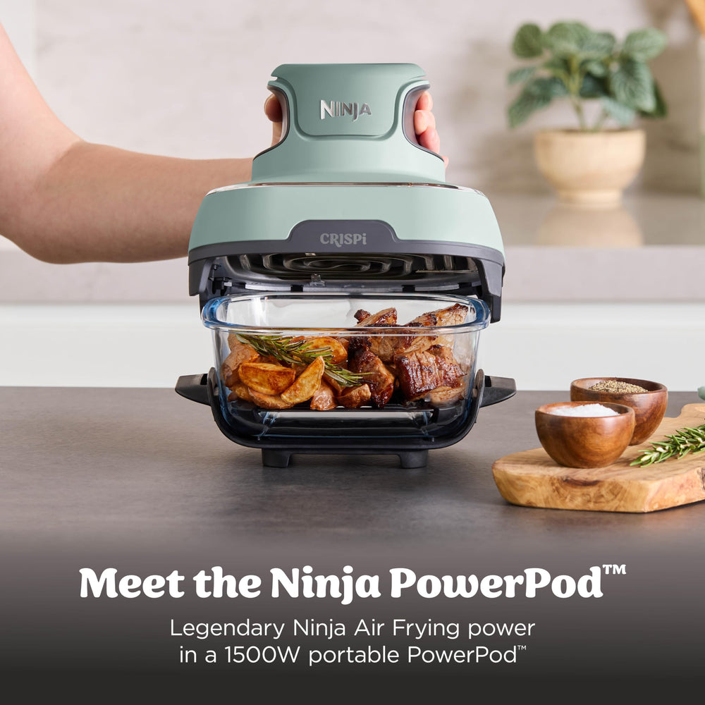 Ninja Crispi 4‑qt container roasting a whole chicken for family-sized meals