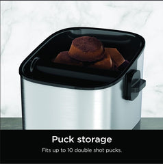 Ninja knock box open interior with espresso pucks showing 10-puck storage benefit