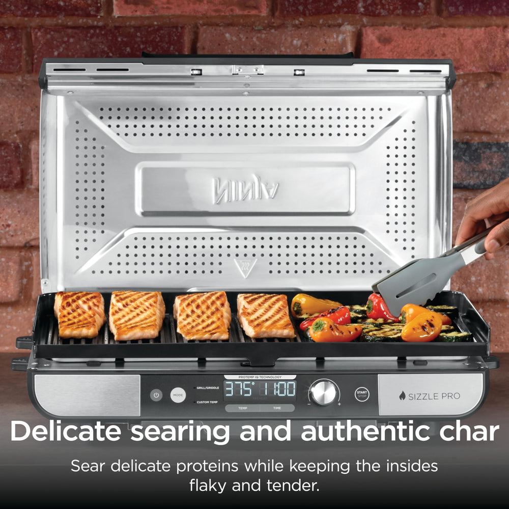 Ninja Sizzle Pro XL removable grease catch detail for cleaner counters and easy disposal