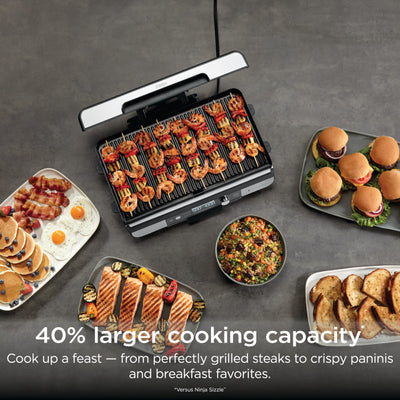Ninja Sizzle Pro XL griddle plate close-up highlighting nonstick ceramic surface for easy release